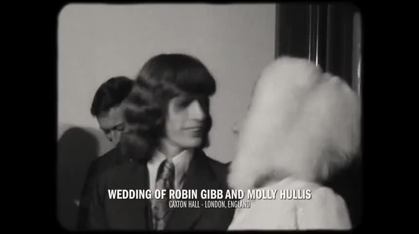 Robin Gibb of the Bee Gees marries Molly Hullis.