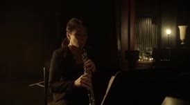 [playing oboe]