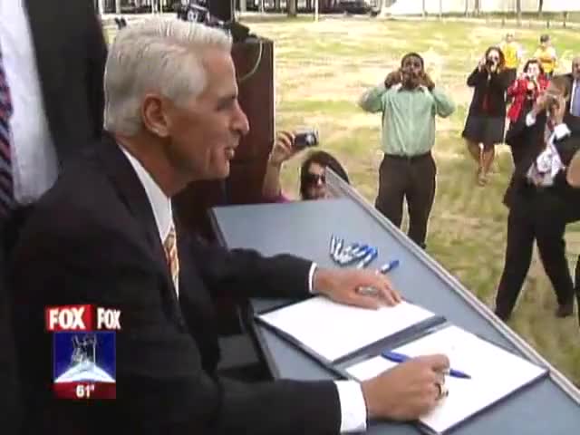 Clip image for 'to be with as governor Charlie Crist signs the bullet train bill in Tampa his own bid for U. S. Senate may
