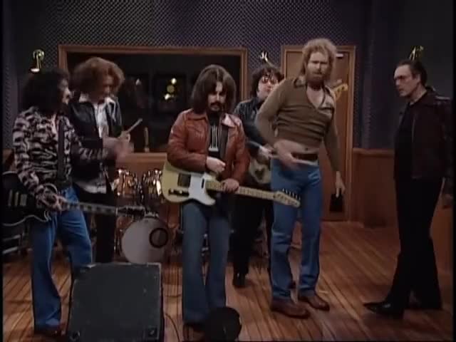Gene, wait! Why don't you lay down that cowbell right now. With us. Together.